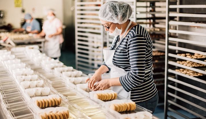 Baker works to create desserts for the day.