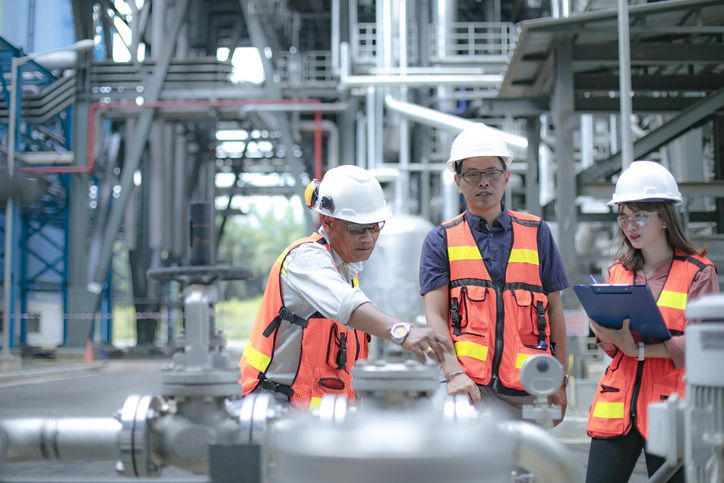 safety manager accompanied by engineers conduct inspection