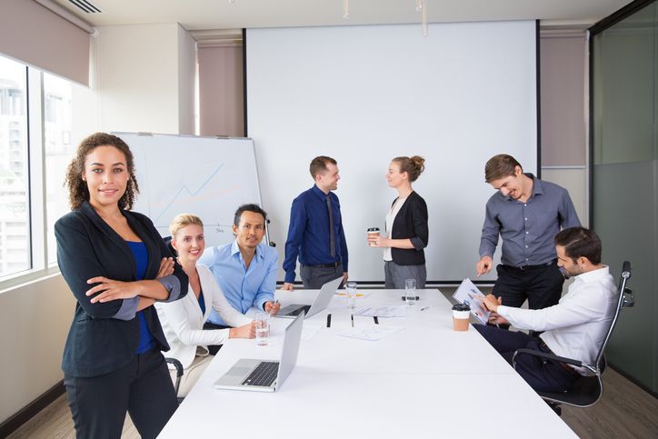 Department leaders gathering to discuss a project in an office.